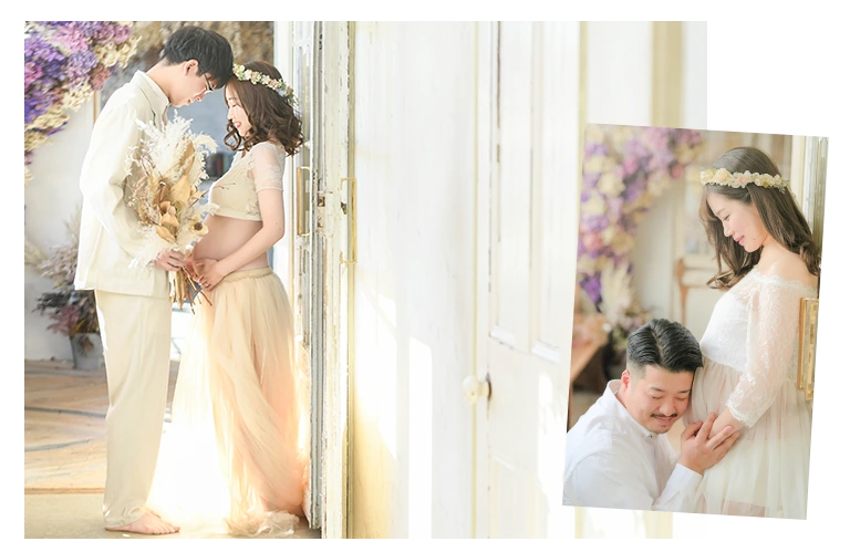 マタニティフォトの夫婦が見つめ合っている写真